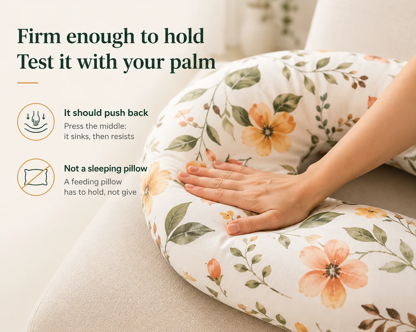 A palm pressing flat on the nursing pillow’s arm, the fabric sinking slightly under the pressure